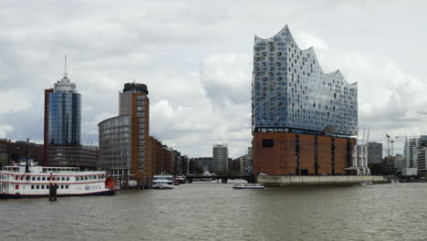View-from-on-the-river-of-the-Elbphilharmonie-building,-in-cloudy-Hamburg,-Germany