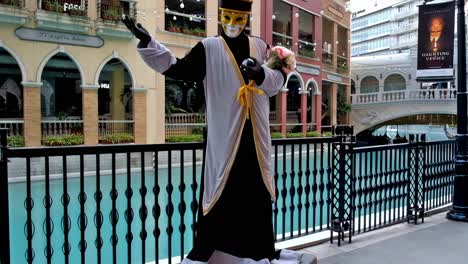 Costumed-mimes-are-a-popular-attraction-at-this-Venice-themed-commercial-complex-in-Bonifacio-Global-City,-Taguig,-Philippines,-which-features-luxury-brand-stores,-food-bazaars,-and-gondola-rides