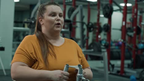 Caucasian-woman-with-overweight-doing-training-at-the-gym.