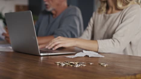 Caucasian-woman-with-senior-man-checking-home-finance-in-documents-and-laptop.