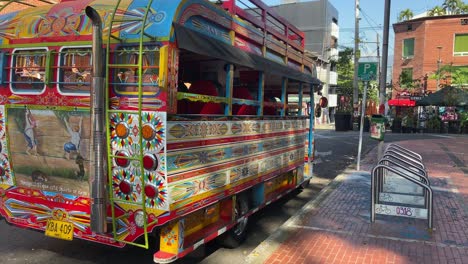 Chiva-rumbera-typical-touristic-colorful-bus-parked-in-the-streets-of-Medellin,-Colombia