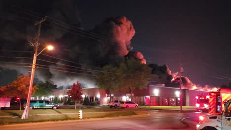 Billowing-black-smoke-at-the-scene-of-a-raging-fire-at-a-commercial-building-as-firefighters-attempt-to-extinguish-the-blaze
