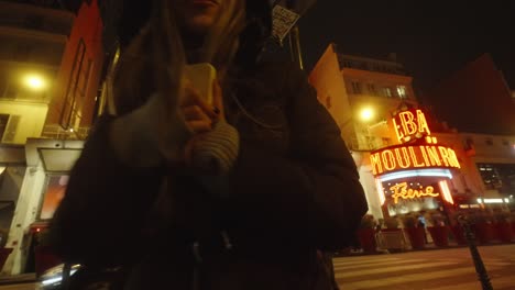 Female-enjoys-chilled-vibrant-street-nightlife-near-Moulin-Rouge