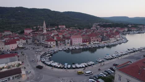 Croatia-Aerial:-Stari-Grad,-Hvar---Coastal-town-blending-natural-beauty-with-urban-life