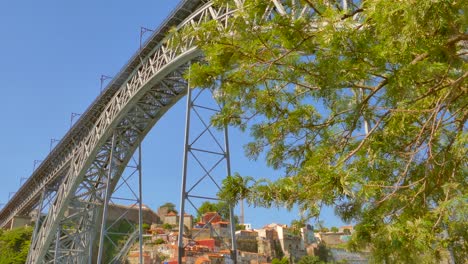 Low-Angle-on-a-sunny-day-from-the-Ponte-Pensil-Dom-Luís-I-in-Porto,-Portugal