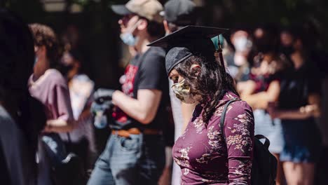 A-Young-Female-Highschool-Student-Wearing-Graduation-Cap-Sad-Disappointed-Protests-Social-Activism-Outside-Ottawa-Ontario-Canada-Prime-Minister-Government-Parliament-Buildings-in-Canadian-Capital-City