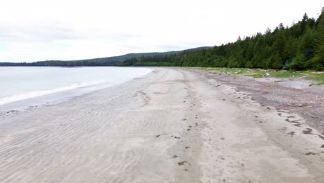 Coastal-Beach-Along-Grey-Bay-Aerial-Dolly-In-Shot-Over-Sandy-Shoreline,-BC,-Canada
