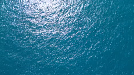 Greece-Blue-Sea-Aerial-View-Looking-Straight-Down-Above-and-Gimbal-upwards-movement