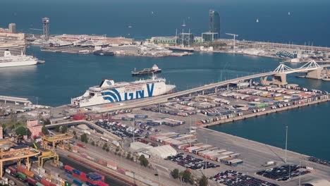 Aerial-Footage-of-Barcelona-Cargo-Harbour:-Vibrant-Container-Yard-in-Action,-Automated-Machines-Loading-and-Unloading-Goods