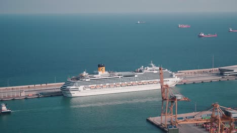 Stunning-Footage-of-Costa-Concordia-Cruise-Ship:-Majestically-Anchored-Near-Barcelona's-Bustling-Cargo-Harbour