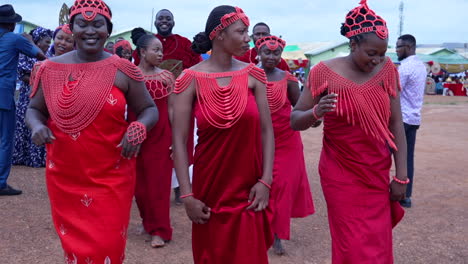 Woman-in-fancy-red-traditional-dress-from-the-Benin-tribe-dance-in-festival-in-Kubwa,-Nigeria-in-slow-motion