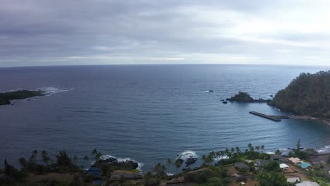 Aerial-wide-dolly-shot-of-Hana-Bay-on-the-eastern-edge-of-Maui-in-Hawai'i