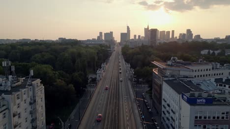 Scenic-skyline-and-traffic-on-highway-to-Warsaw-city,-Poland,-aerial-panorama