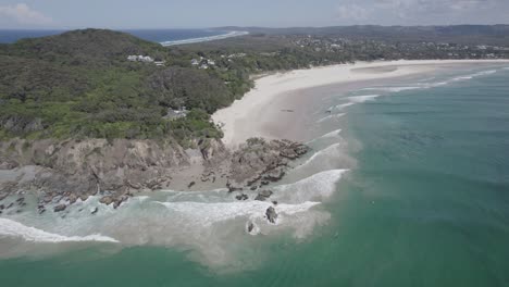 Turquoise-Seascape-And-White-Sandy-Shore-Of-Clarkes-Beach-In-New-South-Wales,-Australia---aerial-drone-shot