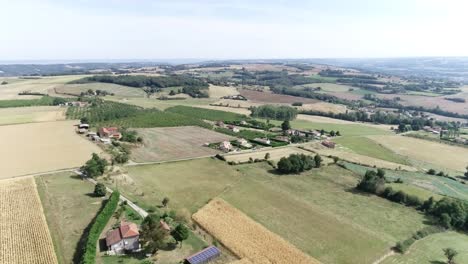 Drone-shot-of-French-village,-with-houses-and-farms