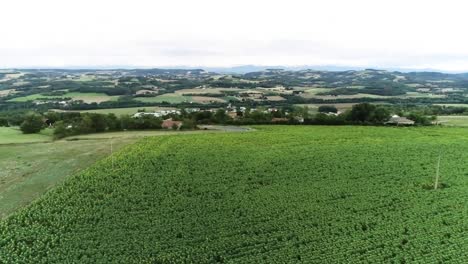 Drone-shot-of-French-landscape-and-village-on-farmland