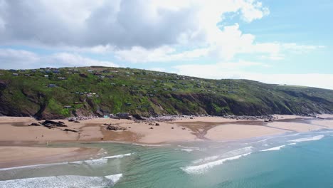 Aerial-View-Over-Whitsand-Bay-Panning-Over-Cornish-Coastline-with-Scenic-Cliffs-and-Landscapes,-Cornwall,-UK