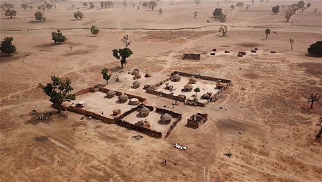 Rural-nomadic-village-in-Nigeria,-West-Africa---aerial-reveal