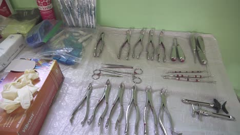 Dental-medical-instruments-on-a-table,-prepared-for-a-medical-brigade-in-a-poor-community