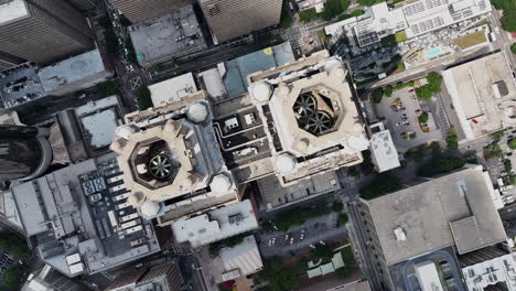 Top-down-rotating-footage-of-high-rise-downtown-buildings-in-modern-city