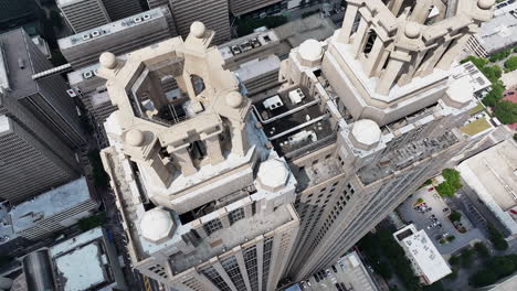 High-angle-view-of-tall-business-skyscraper-with-pair-of-rooftop-crowns