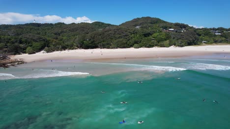 Tourists-Enjoying-Summer-Holidays-In-Clarkes-Beach,-NSW,-Australia---aerial-drone-shot