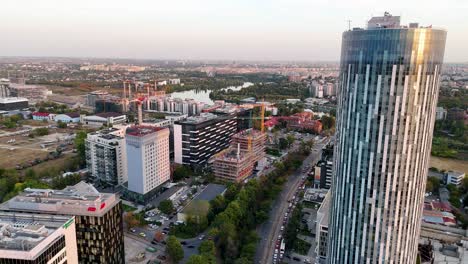 Aerial-View-of-Bucharest-City-Skyline-at-Sunset,-Romania