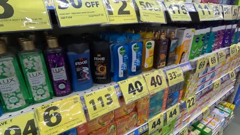 POV-shoot,-a-beautiful-woman-is-buying-total-products-of-Dettol-brand-approaching-heat-from-a-shopping-mall
