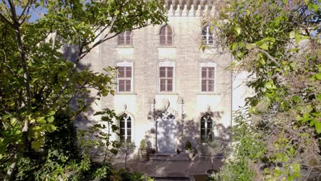 Frontal-aerial-view-of-a-big-french-architectural-Castle-in-southern-france