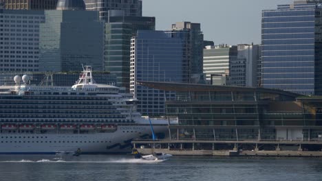 Seaplane-Taking-Off-From-Vancouver-Port-Next-Big-Cruise-Ship-TRACK