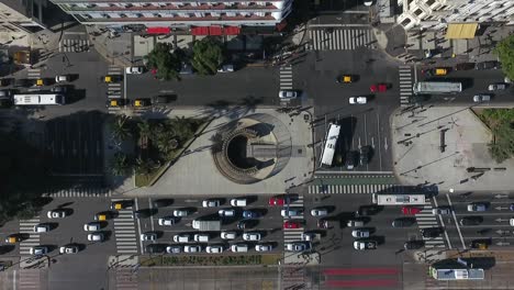 Aerial-shot-moving-away-from-the-9-de-Julio-Avenue-of-Buenos-Aires-Argentina-during-the-day-with-flowing-traffic
