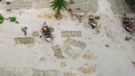 Aerial-overhead-view-of-wooden-fishing-boats-on-a-beach-in-Bangladesh
