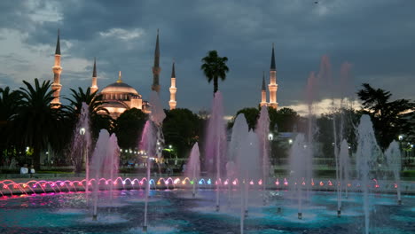 Blue-mosque-Sultanahmet-illuminated-at-night-and-colourful-water-fountains