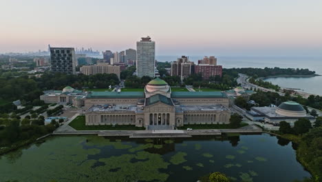 Aerial-view-over-the-Museum-of-Science-and-Industry,-sunrise-in-Chicago,-USA