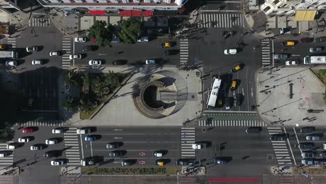 "Aerial-shot-overhead-shot-approaching-9-de-Julio-avenue-in-Buenos-Aires-Argentina-during-the-day-with-flowing-traffic