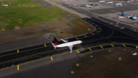 Airplane-arrival-via-new-taxiway-Mike-towards-Keflavik-airport-apron-in-Iceland