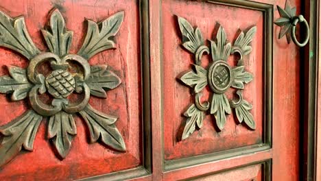 Carvings-on-red-wooden-cupboards