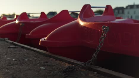 Red-paddle-boats-sit-empty-as-evening-closes-in