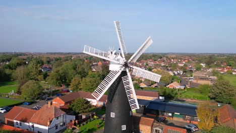 Above-the-countryside,-video-footage-reveals-the-renowned-Waltham-Windmill-and-Rural-History-Museum-in-Lincolnshire,-UK