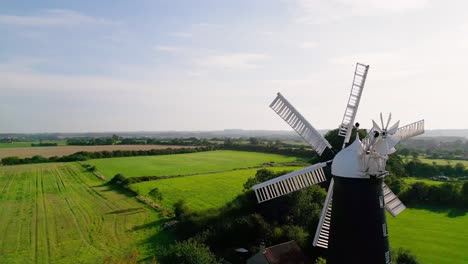From-above,-video-footage-showcases-the-iconic-Waltham-Windmill-and-Rural-History-Museum-in-Lincolnshire,-UK
