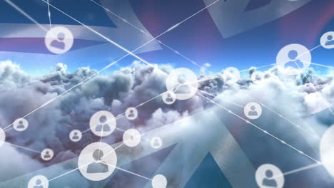 Animation-of-network-of-connections-with-icons-over-flag-of-great-britain-and-clouds-on-sky