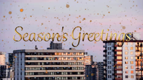 Animation-of-seasons-greetings-text-with-orange-spots-falling-over-cityscape-background