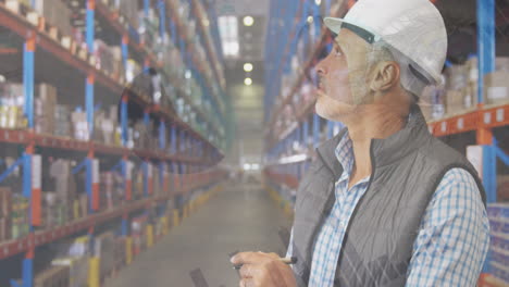 Animation-of-infographic-interface-over-caucasian-man-checking-inventory-in-warehouse