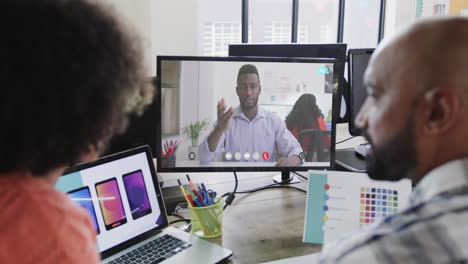 African-american-business-people-on-video-call-with-african-american-male-colleague-on-screen