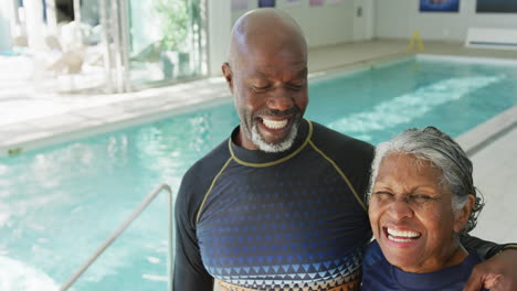 Video-of-happy-senior-african-american-couple-swimming