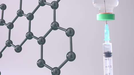 Molecular-structure-model-over-syringe-in-vaccine-vial