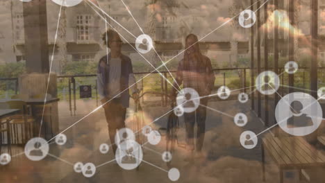 Animation-of-network-of-connections-and-sky-with-clouds-over-african-american-men-walking-with-bikes