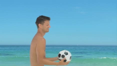 Handsome-man-playing-with-a-soccer-ball