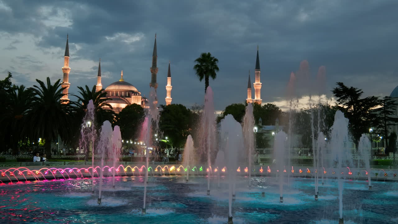 Blue Mosque Sultanahmet Illuminated At Night And Colourful Water ...