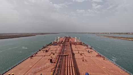 Timelapse-oil-tanker-max-bow-transit-crossing-Suez-canal-cloudy-day